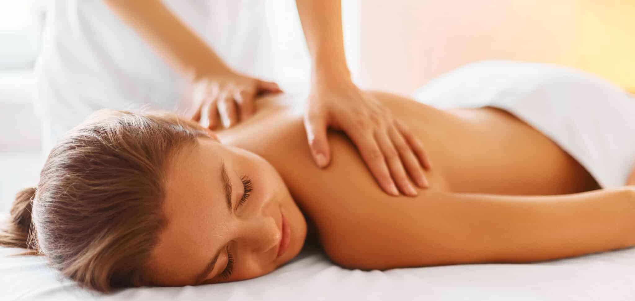 Spa Woman. Female Enjoying Massage in Spa Centre